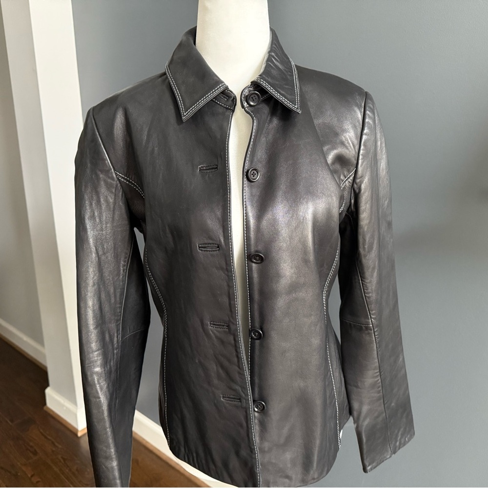 Black Ann Taylor leather jacket with white stitch detail.